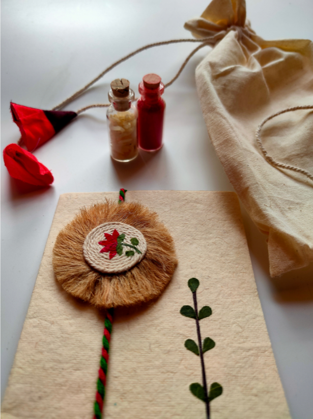Eco-Friendly Handmade Jute Rakhi with Dried Leaves and Flower Petals (Comes with a Reusable Cloth Pouch and Recycled Paper Card)