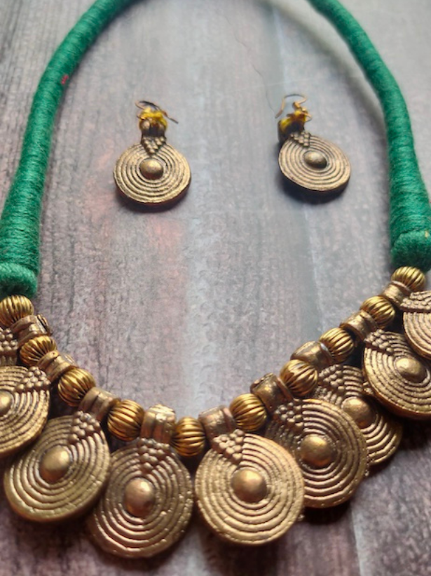 Brass Finish Dhokra Necklace Set with Green Thread Closure