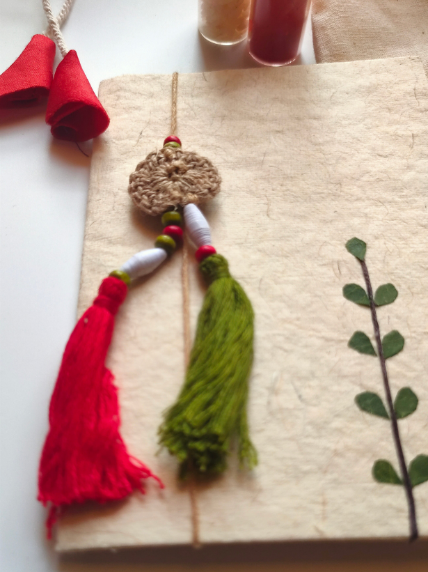 Eco-Friendly Handmade Jute Lumba Rakhi with Dried Leaves and Flower Petals (Comes with a Reusable Cloth Pouch and Recycled Paper Card)