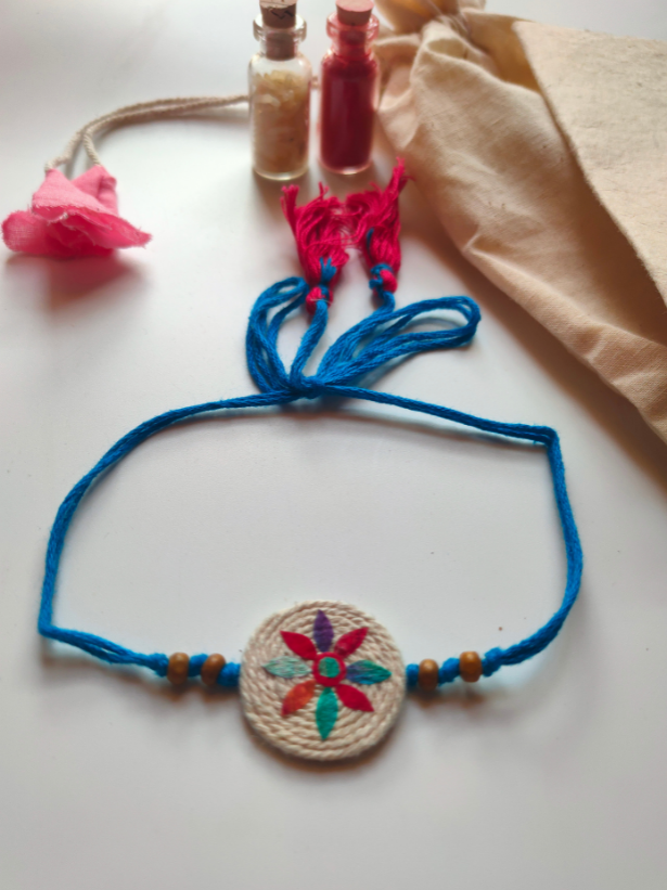 Eco-Friendly Handmade Jute & Thread Rakhi with Dried Leaves and Flower Petals (Comes with a Reusable Cloth Pouch and Recycled Paper Card)