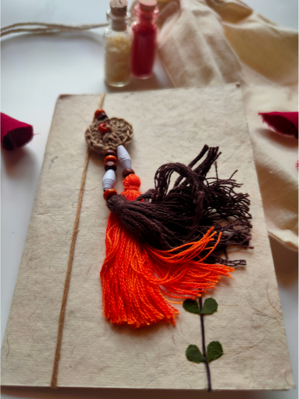 Eco-Friendly Handmade Jute & Thread Lumba Rakhi with Dried Leaves and Flower Petals (Comes with a Reusable Cloth Pouch and Recycled Paper Card)