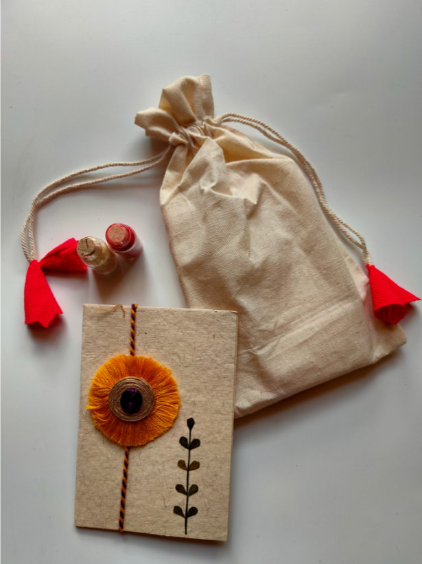 Eco-Friendly Handmade Jute & Thread Flower Rakhi with Dried Leaves and Flower Petals (Comes with a Reusable Cloth Pouch and Recycled Paper Card)