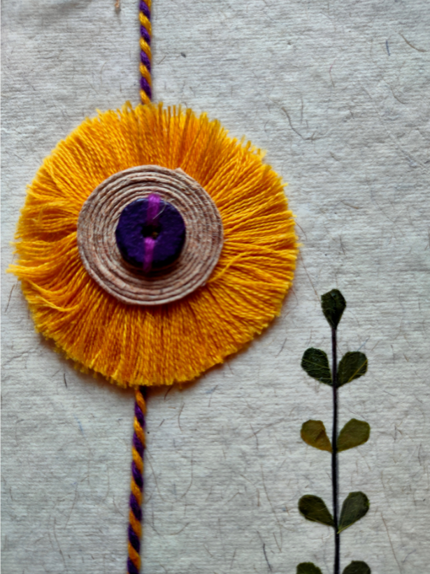 Eco-Friendly Handmade Jute & Thread Flower Rakhi with Dried Leaves and Flower Petals (Comes with a Reusable Cloth Pouch and Recycled Paper Card)