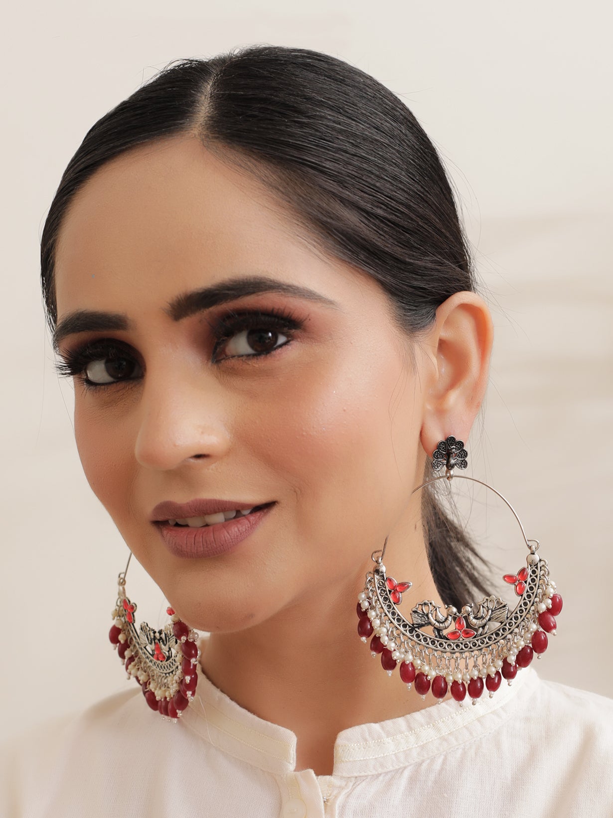 Chandbali Dangler Earrings with Peacock Motifs and Maroon Beads