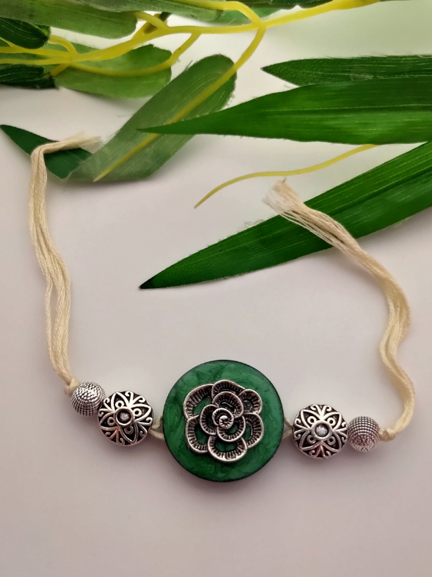 Intricately Detailed Wood and Metal Rakhi with Off-White Cotton Thread