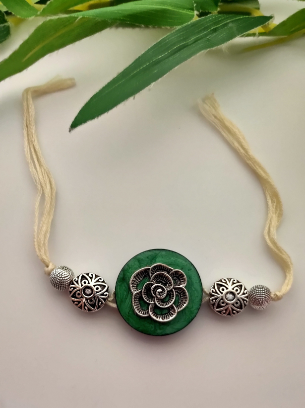Intricately Detailed Wood and Metal Rakhi with Off-White Cotton Thread