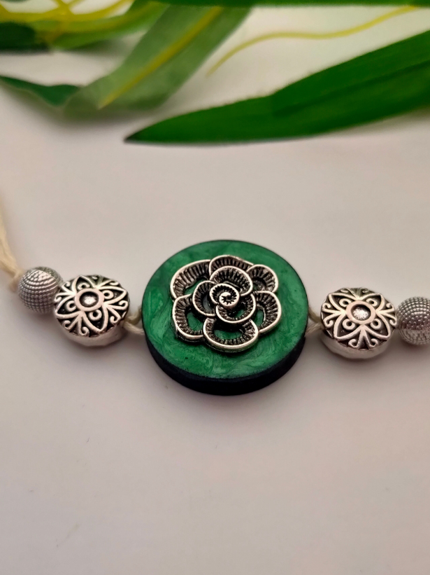Intricately Detailed Wood and Metal Rakhi with Off-White Cotton Thread