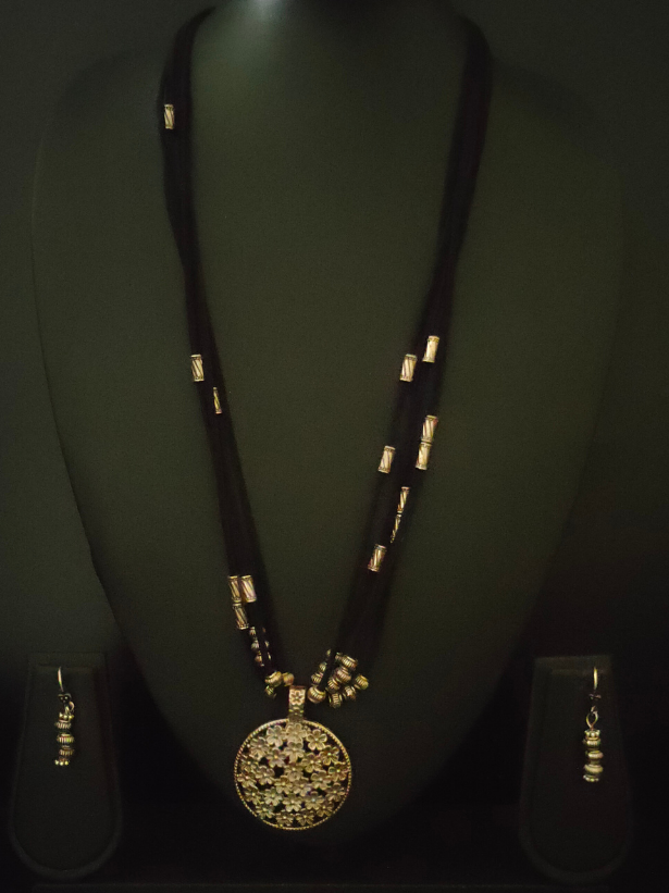 4 Layer Necklace Set with Intricately Detailed Metal Pendant