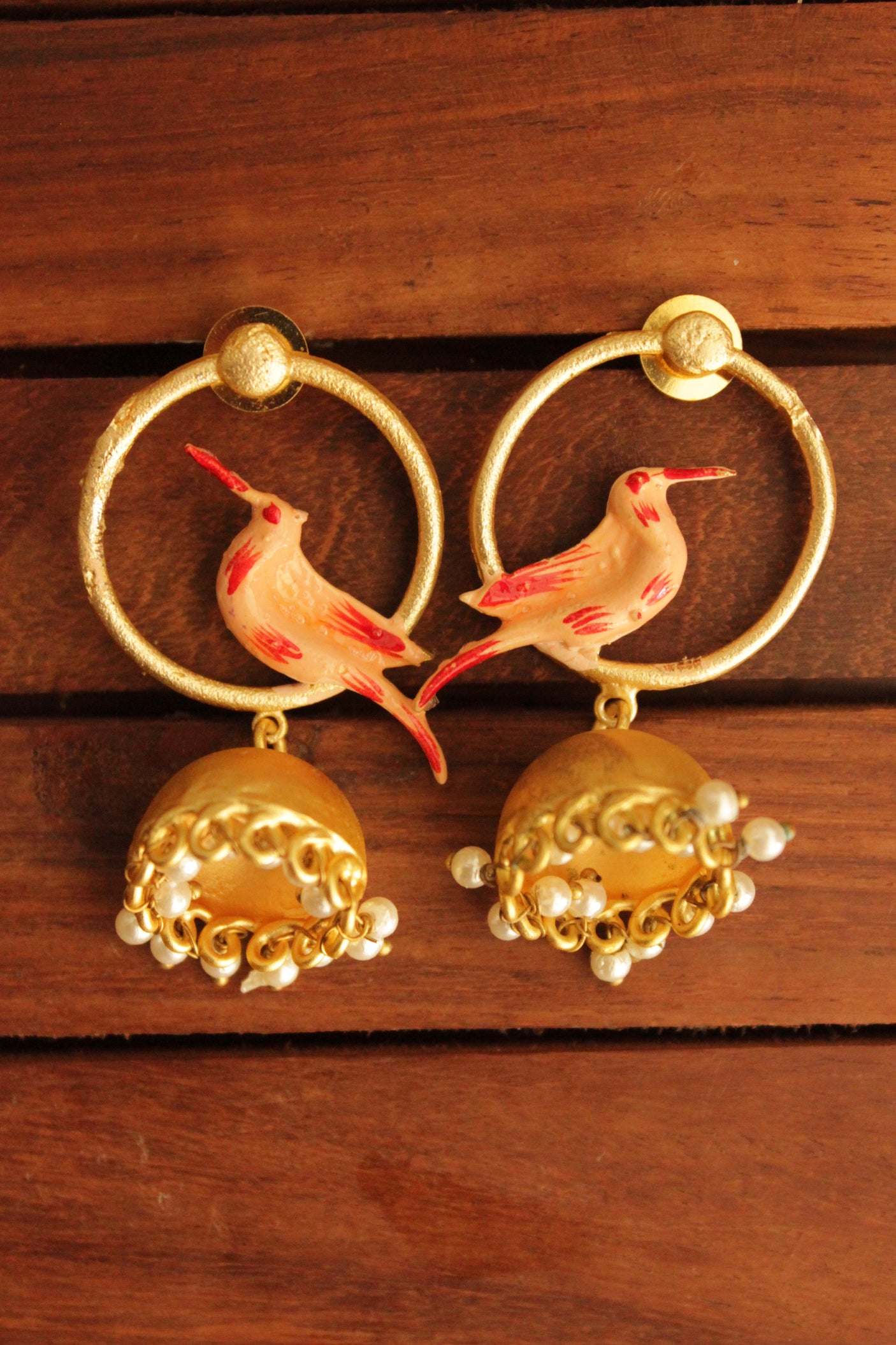 Bird Motif Hand Painted Gold Toned Handmade Brass Hoop Jhumka Earrings Accentuated with White Beads