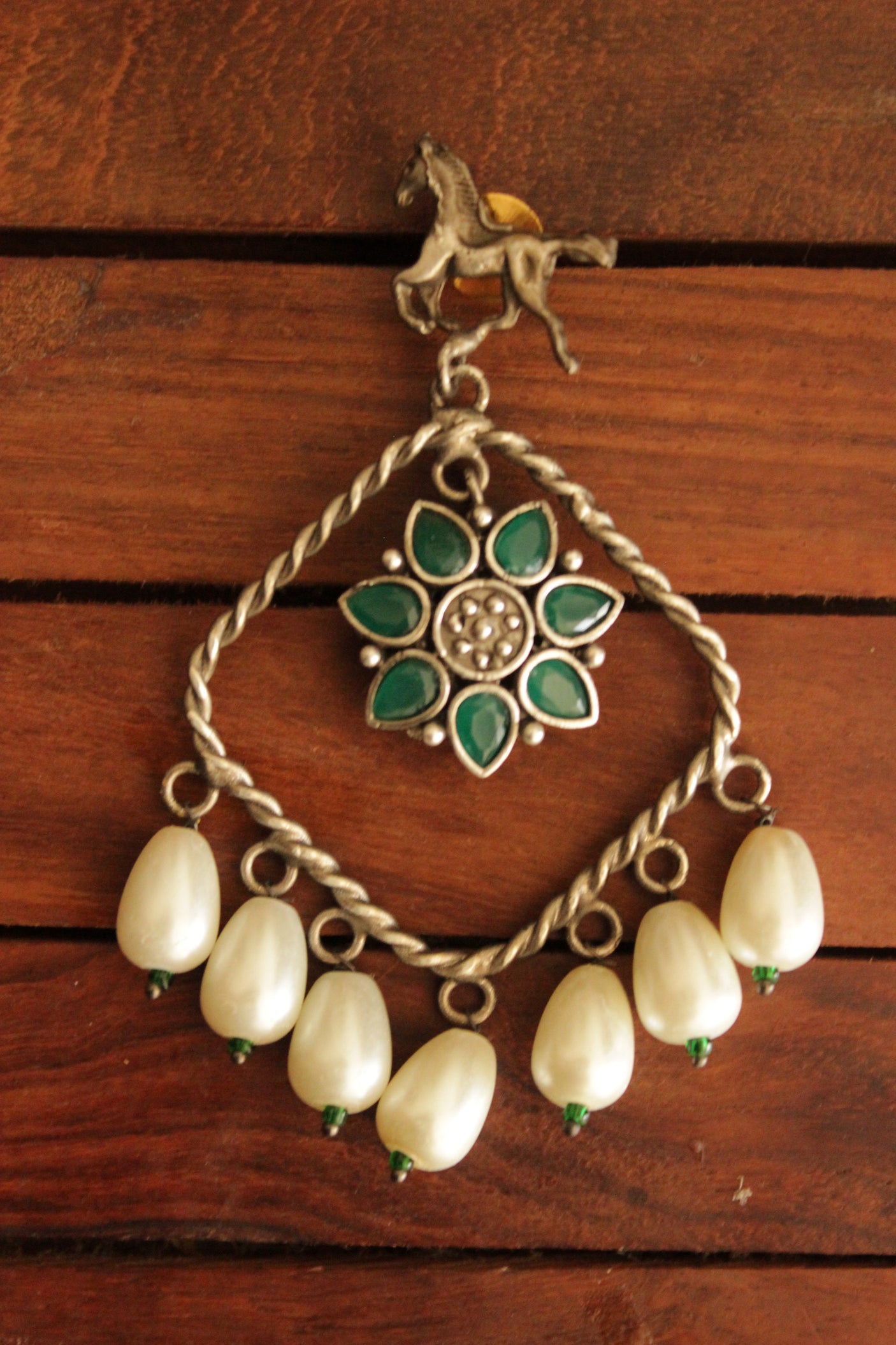 Horse Motif Green Stone Embedded Oxidised Finish Brass Earrings Accentuated with White Pearl Danglers