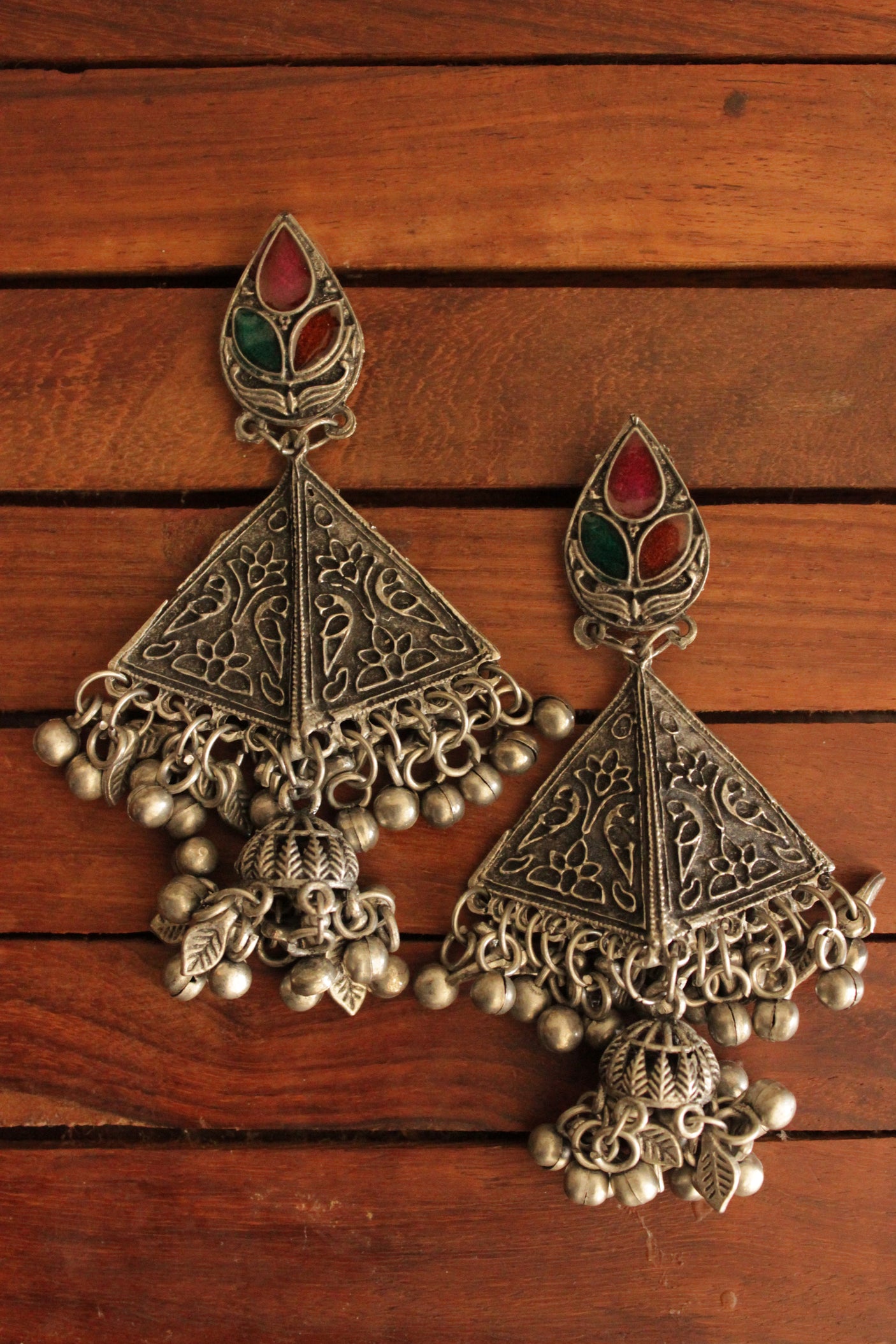 Oxidised Finish Detailed Brass Triangular Earrings with Embedded Glass Stones and Ghungroo Beads