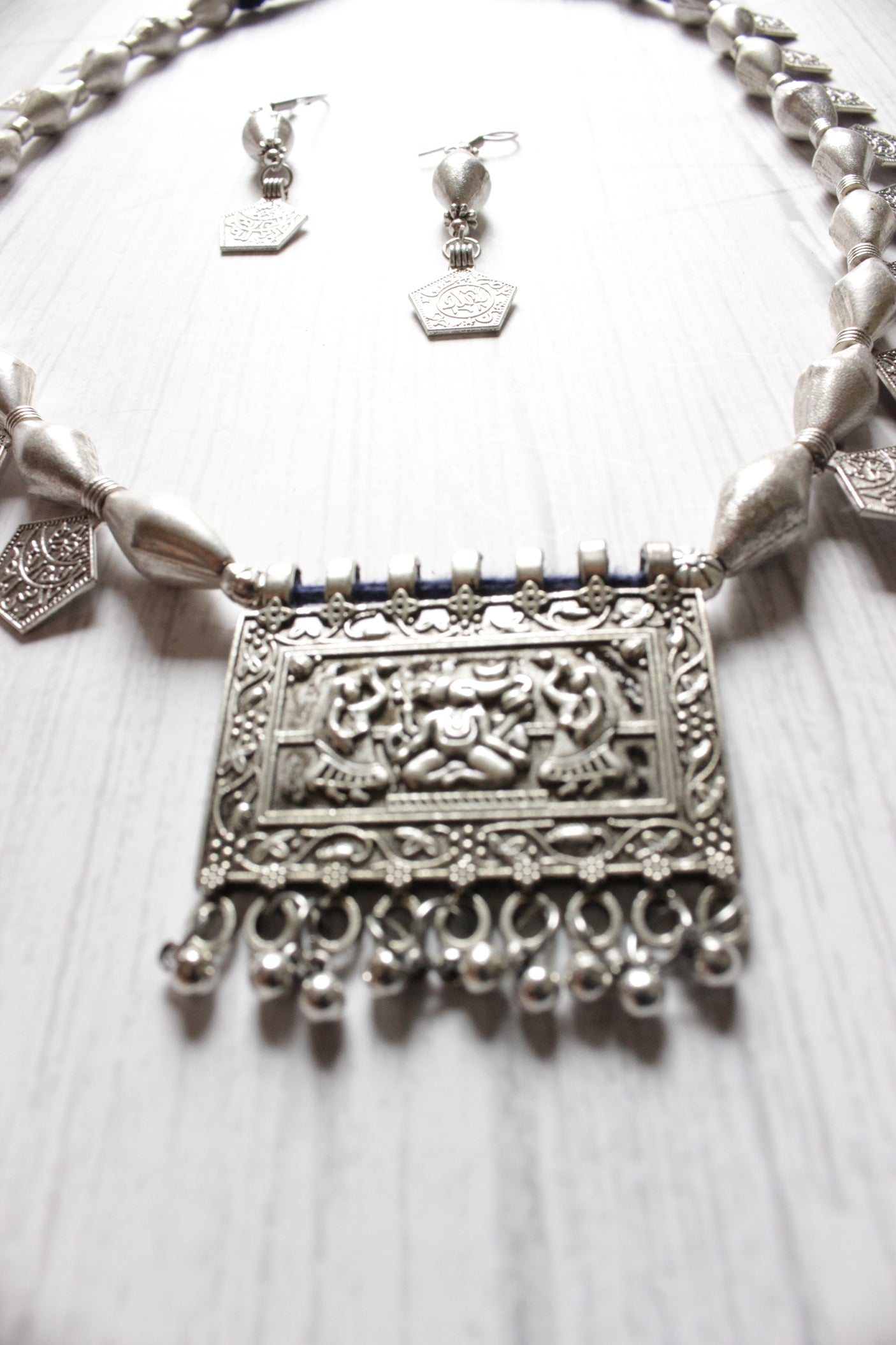 Dholki Beads and Stamped Coins Embellished Ganesha Motif Necklace Set