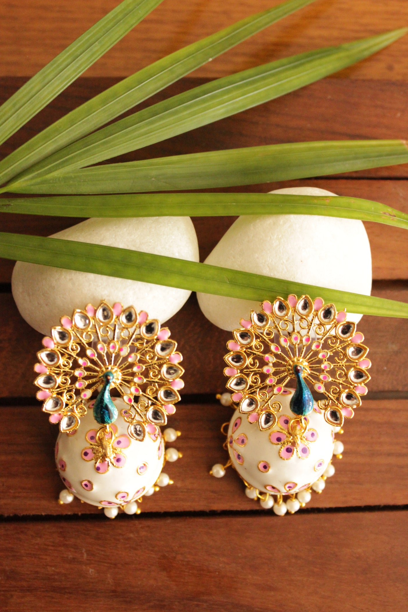 Elaborate Peacock Gold Toned Hand Painted Kundan Stones Embedded White Meenakari Jhumka Earrrings