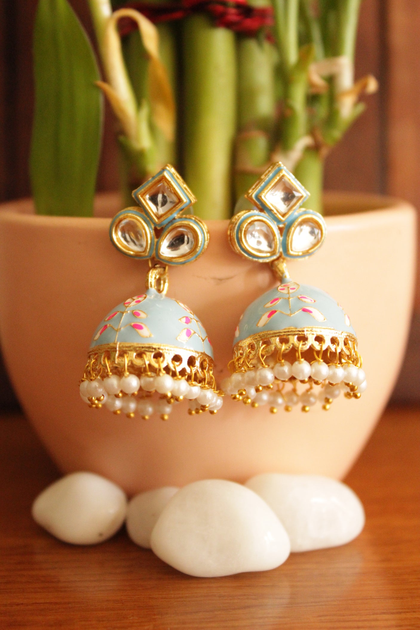 Kundan Stones Embedded Gold Toned Hand Painted Powder Grey Meenakari Jhumka Earrrings