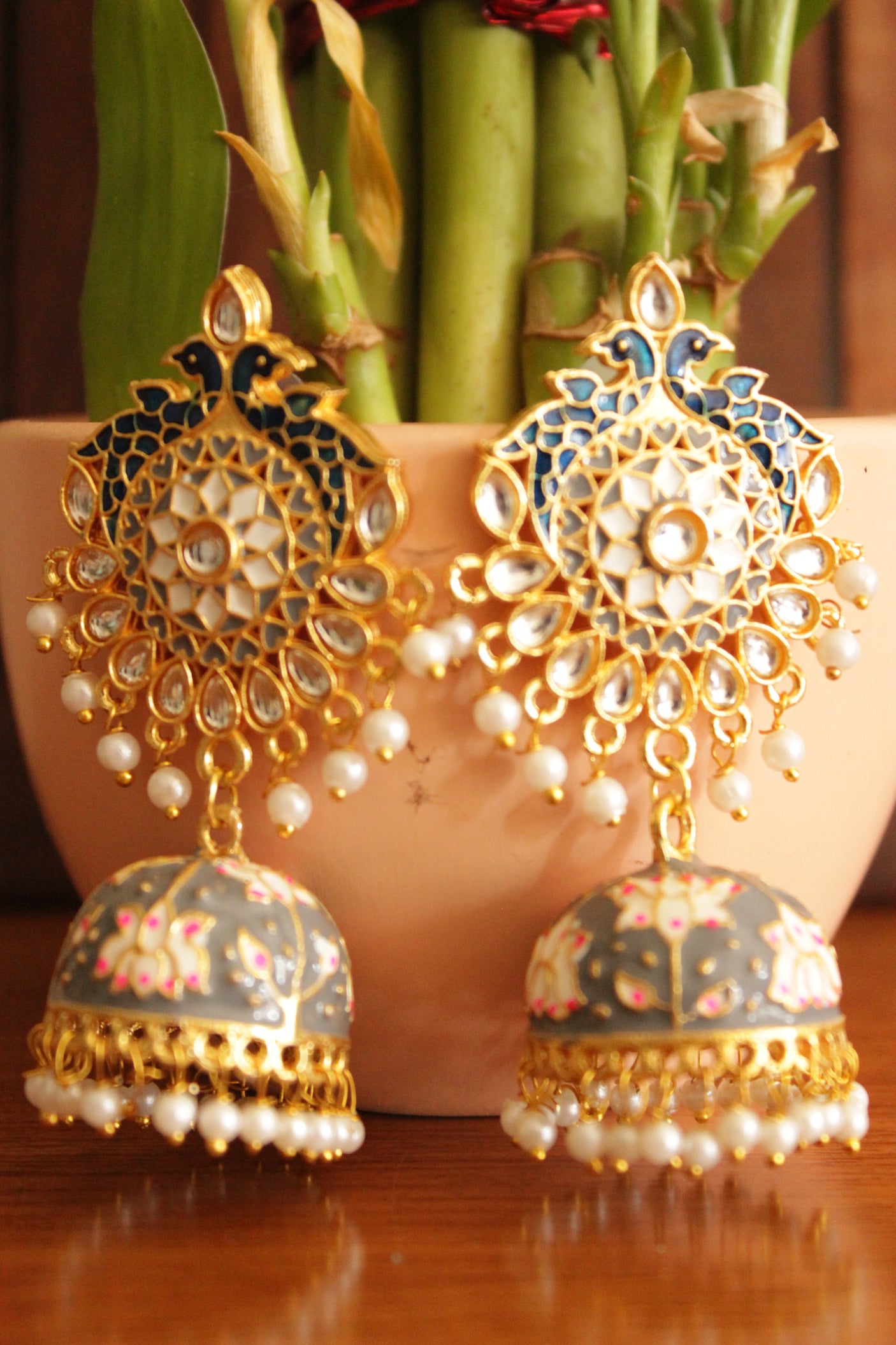 Elaborate Kundan Stones Embedded Gold Toned Hand Painted Peacock Motifs Grey Meenakari Jhumka Earrrings