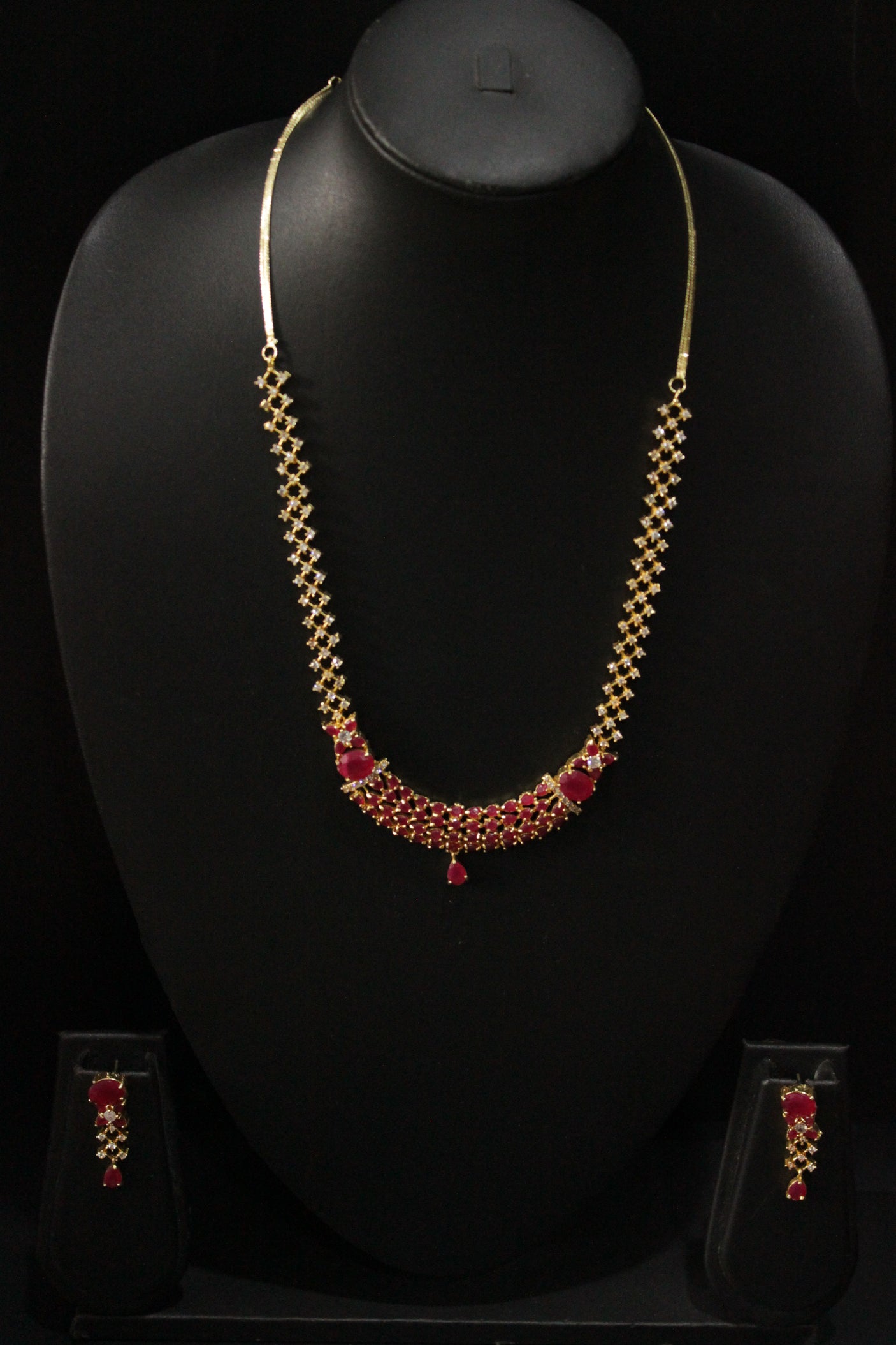 Red Ruby Stones and American Diamond Studded Delicate Gold Finish Necklace Set with Dangler Earrings