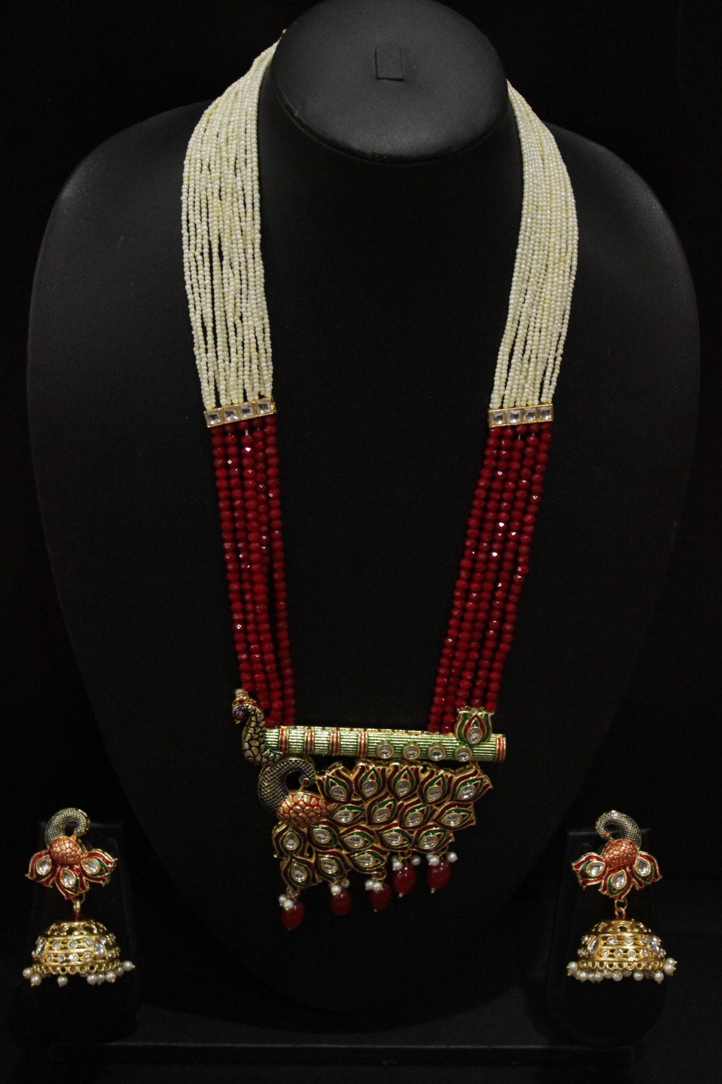 Kundan Stones Embedded Enamel Painted Peacock and Bansuri Motif Pendant Multi-Layer Red Beads Necklace Set