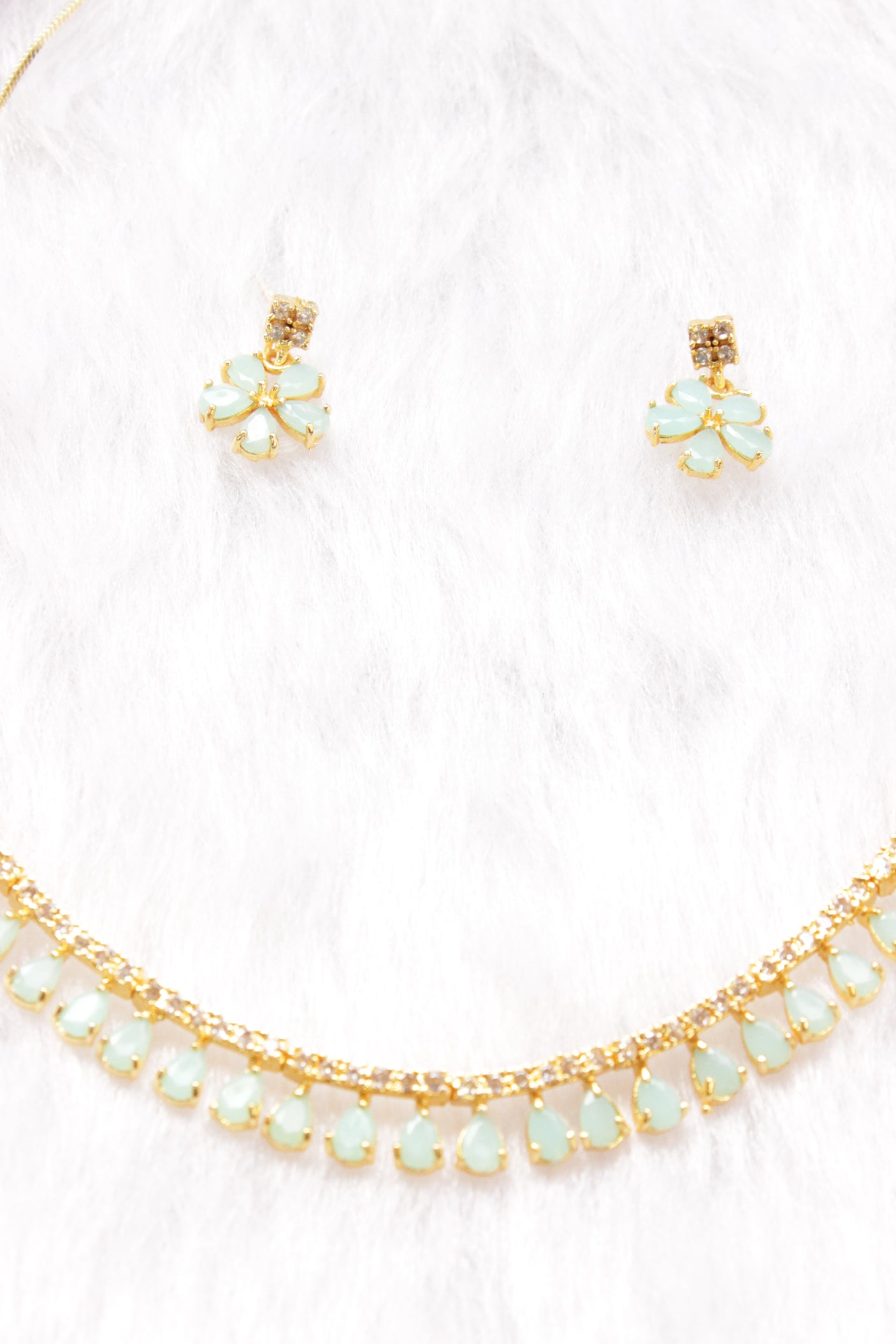Turquoise Stones and American Diamond Studded Delicate Gold Finish Necklace Set