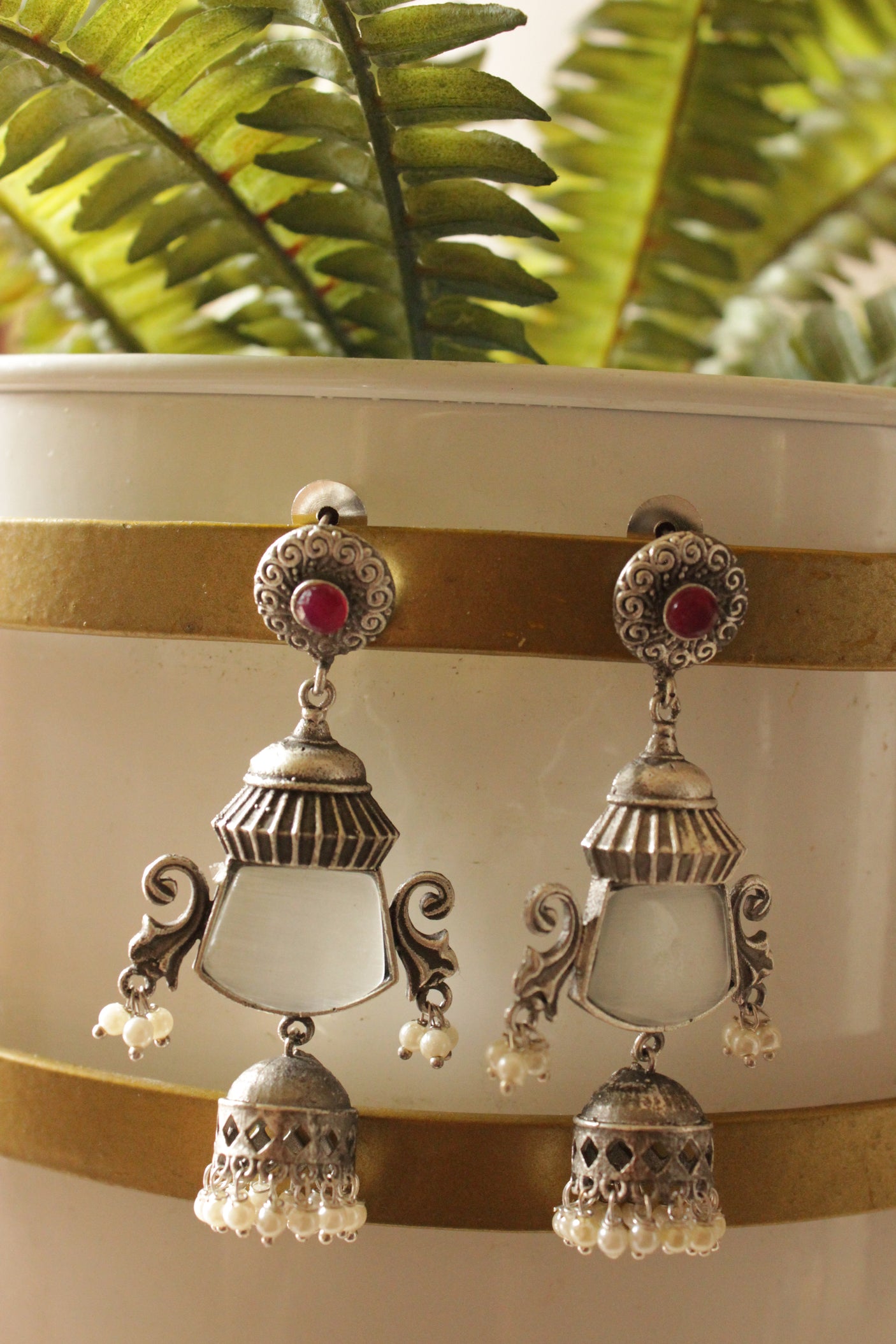 Ivory Natural Gemstone Embedded Premium Silver Finish Dangler Jhumka Earrings