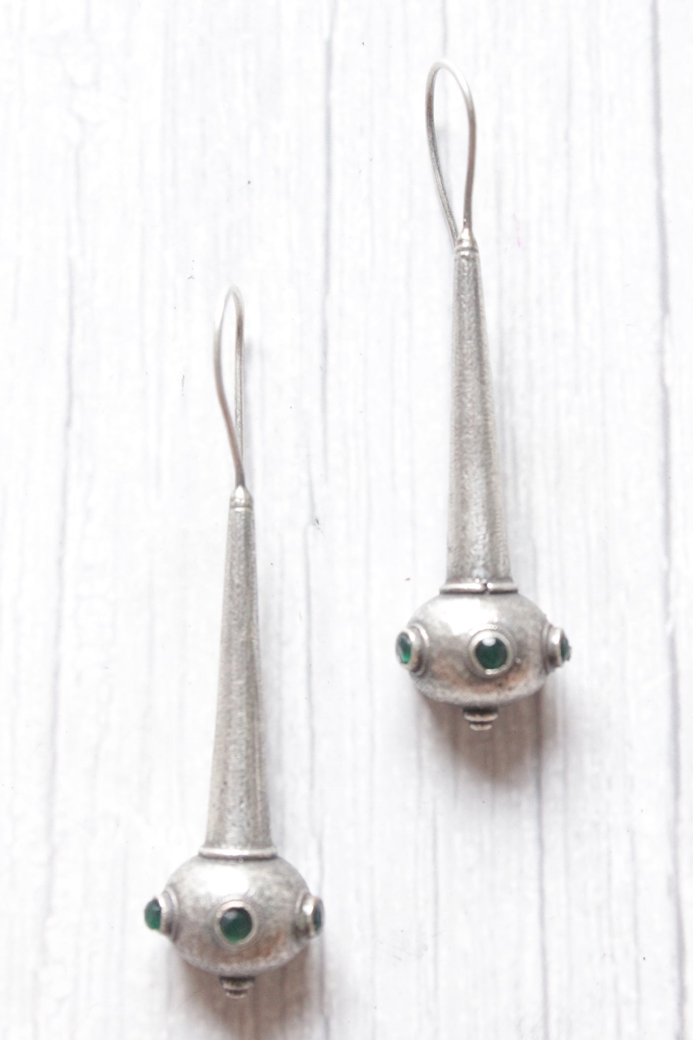 Green Stones Embedded Silver Finish Dangler Earrings