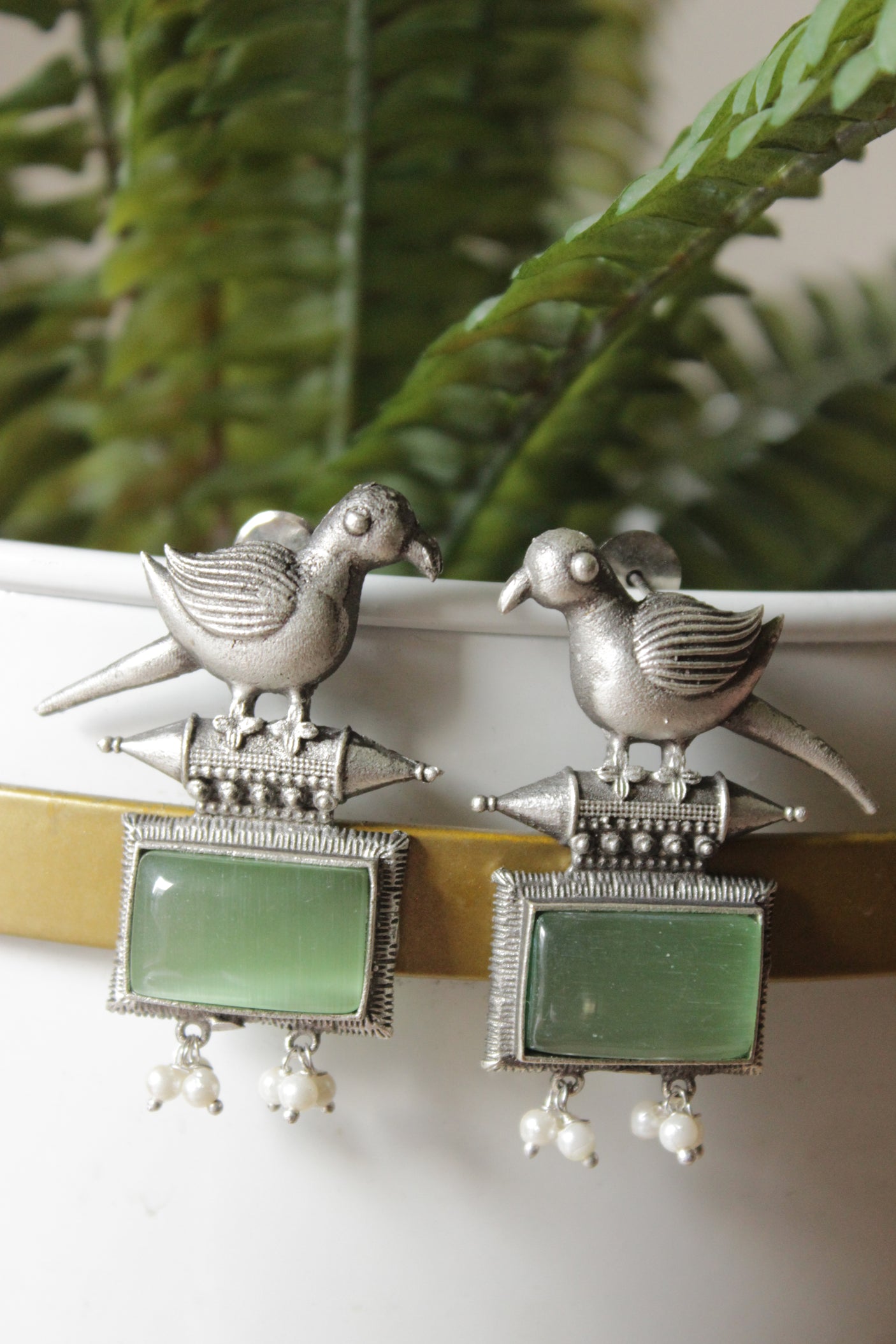 Peacock Motif Sea Green Glass Stone Embedded Silver Finish Brass Dangler Earrings