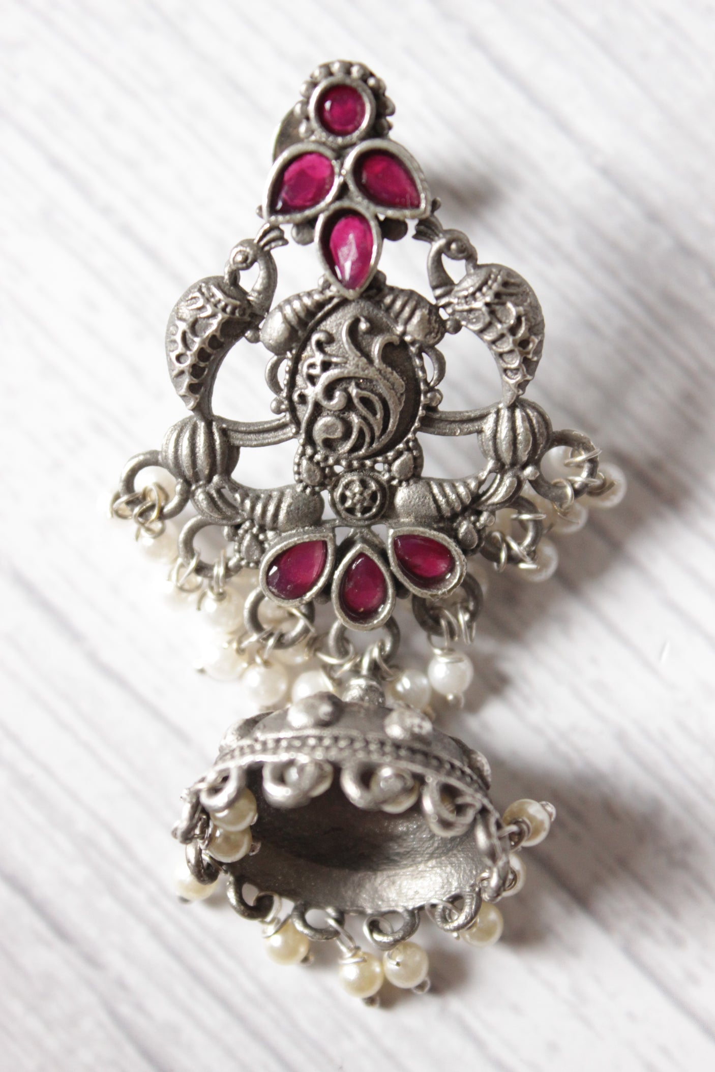 Intricately Detailed Red Glass Stones Embedded Brass Statement Dangler Earrings Accentuated with White Beads