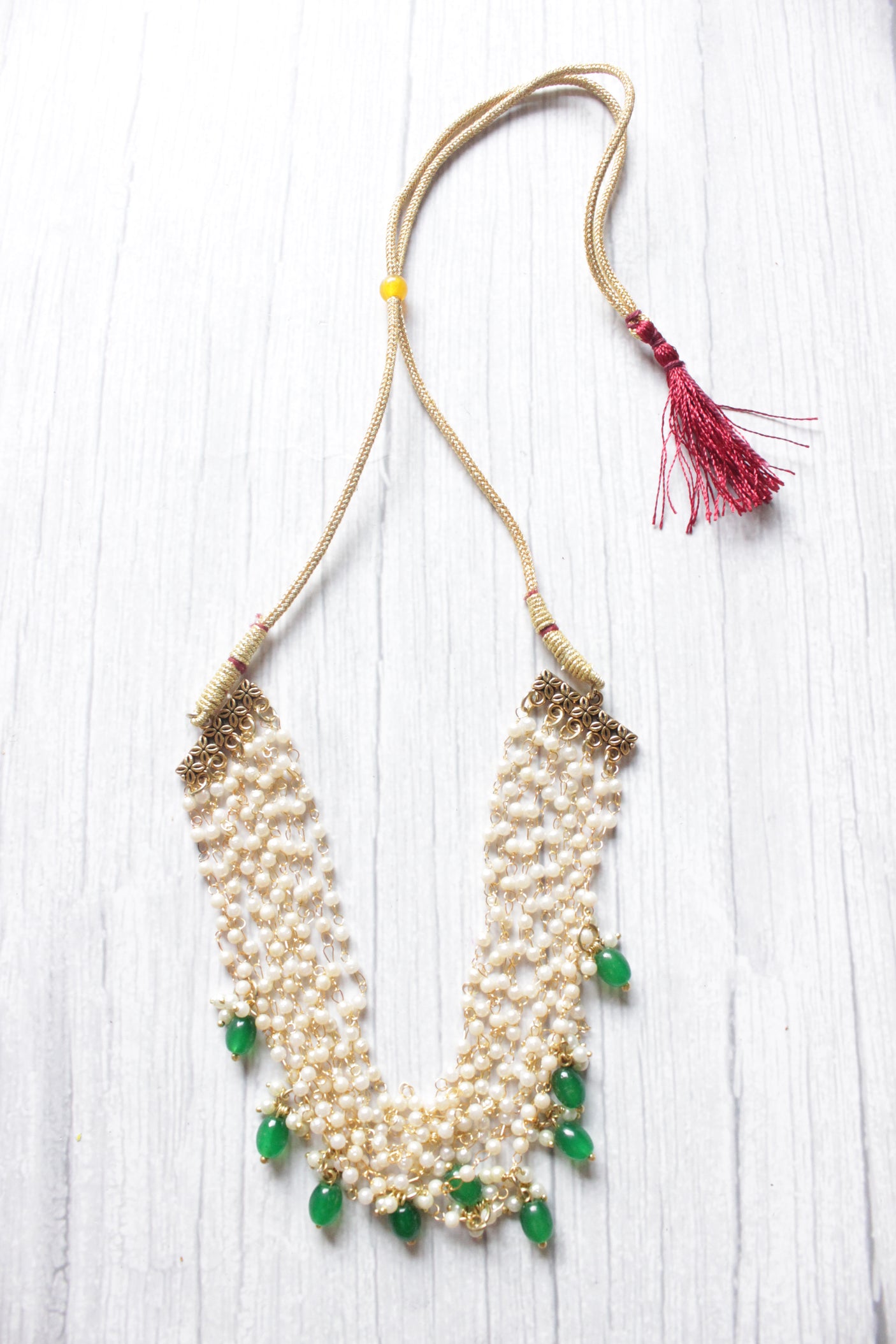 Multi-Layer Pearl Braided Necklace Embellished with Green Stones