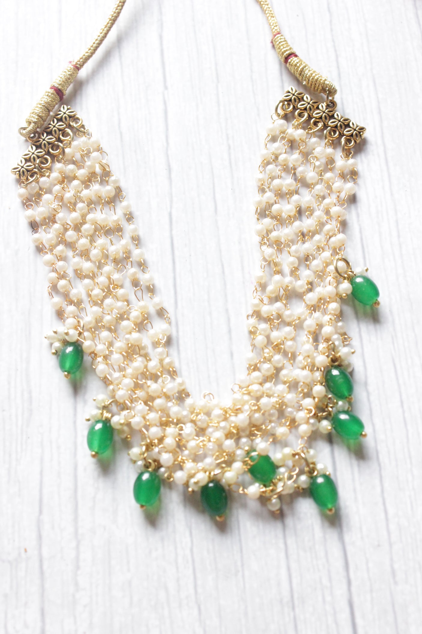 Multi-Layer Pearl Braided Necklace Embellished with Green Stones