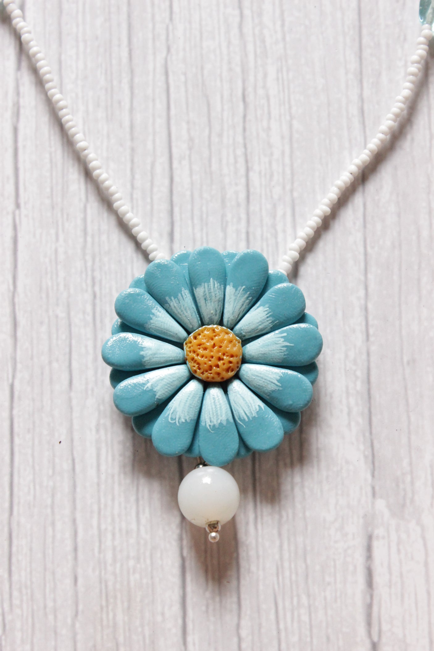 Shades of Blue Handcrafted Clay Flower Jewelry with White Beaded Strings Closure
