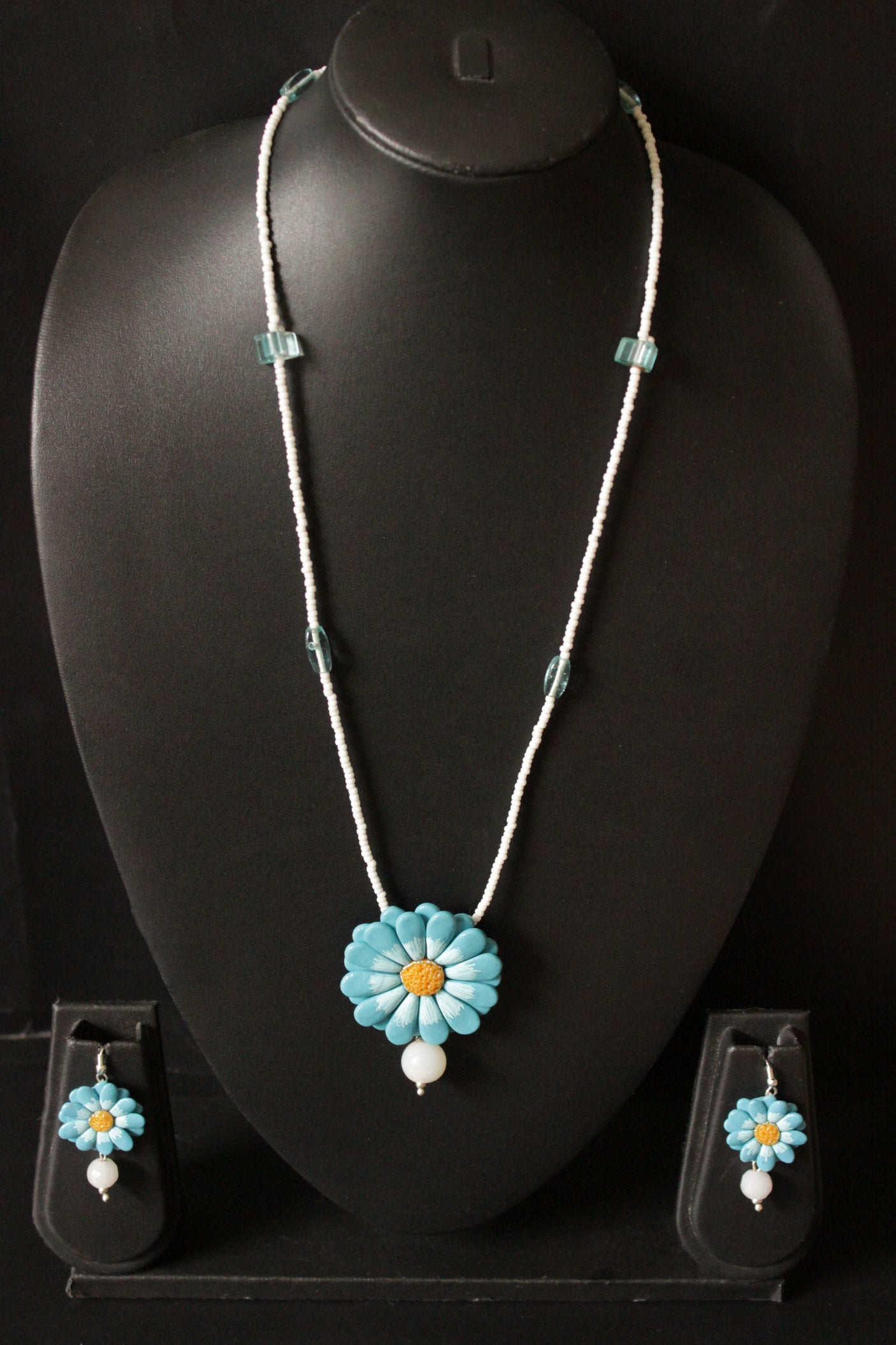 Shades of Blue Handcrafted Clay Flower Jewelry with White Beaded Strings Closure