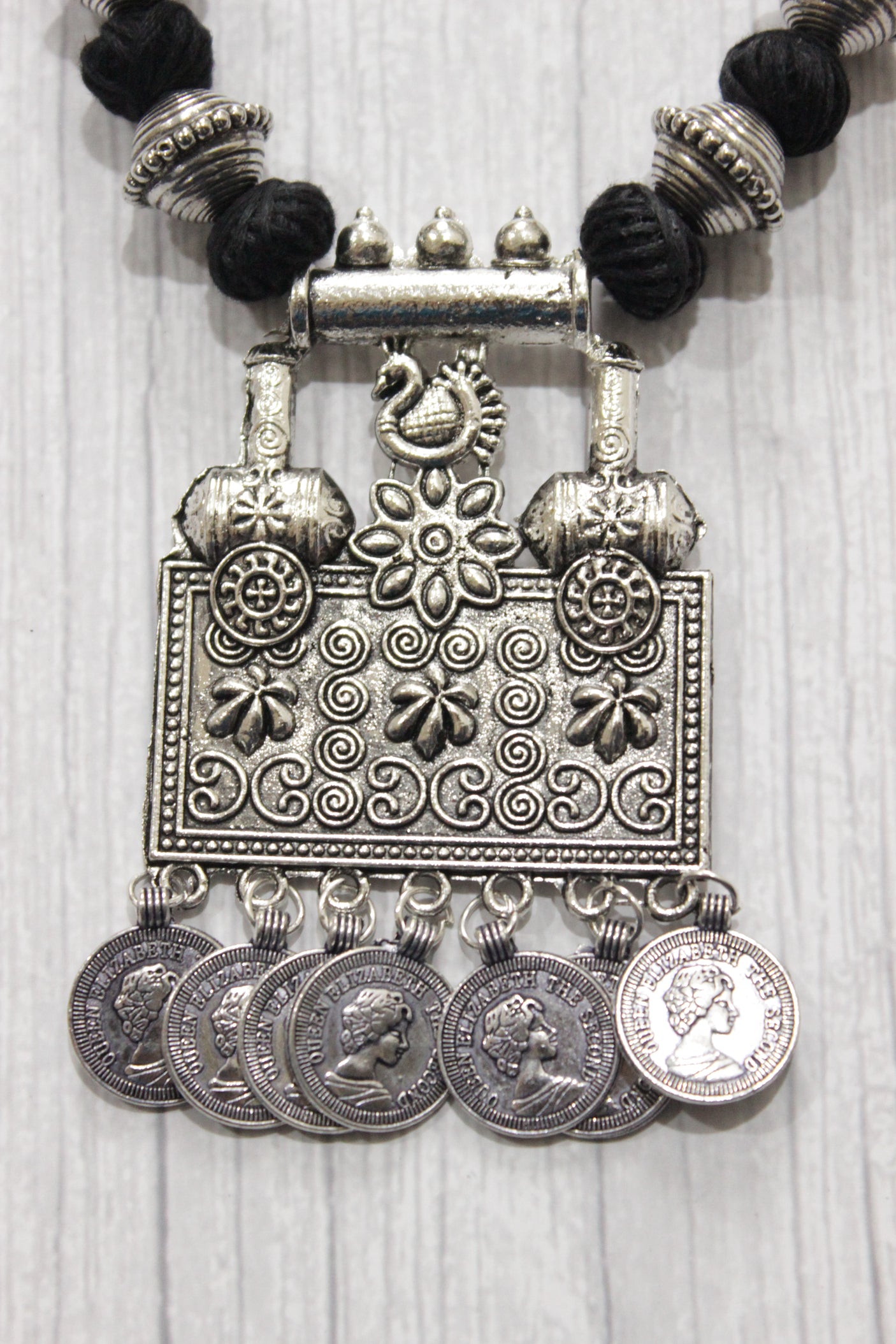 Intricately Detailed Statement Pendant Necklace with Stamped Coins and Thread Closure