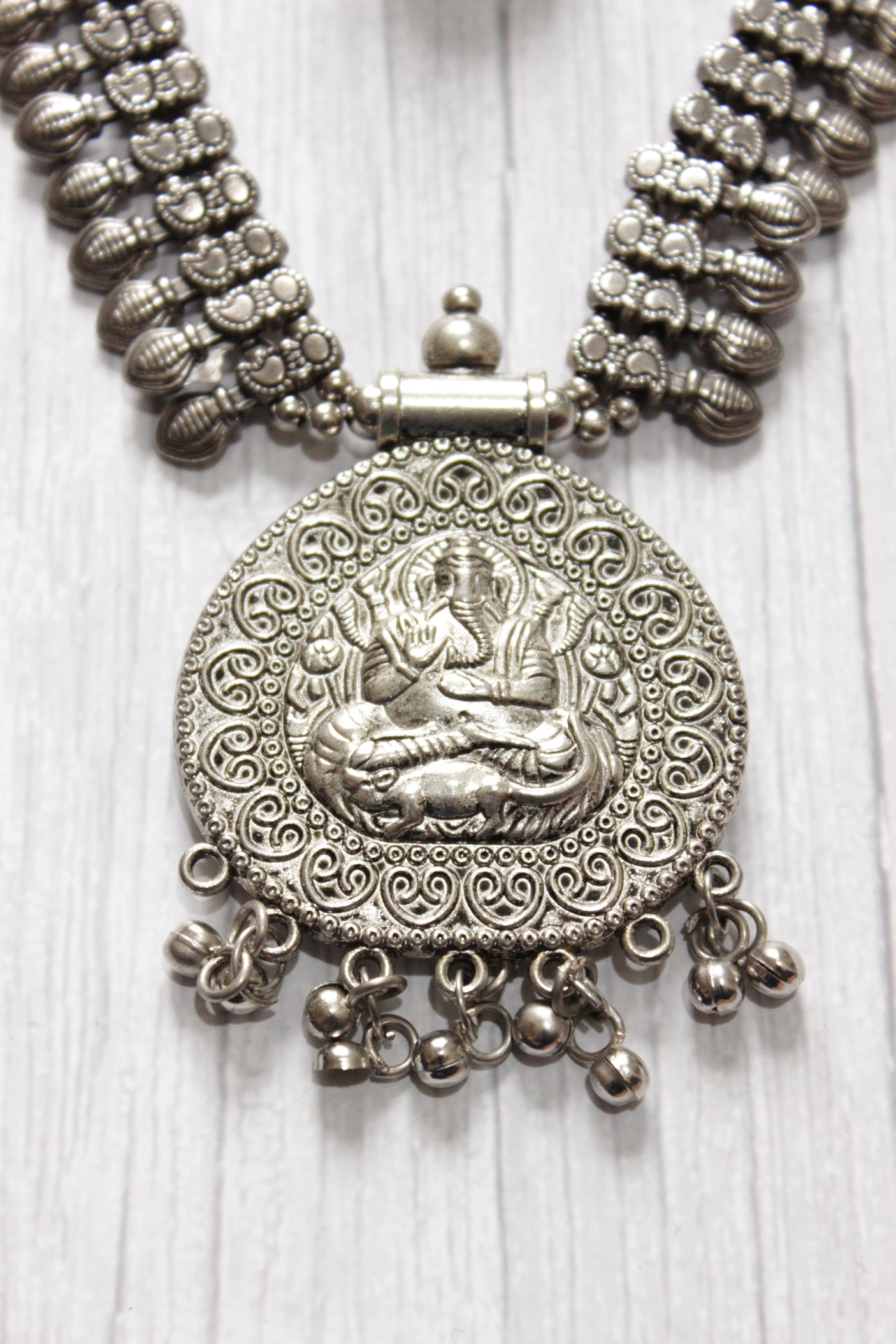 Elaborately Detailed Ganesha Pendant Long Necklace Set with Jhumka Earrings