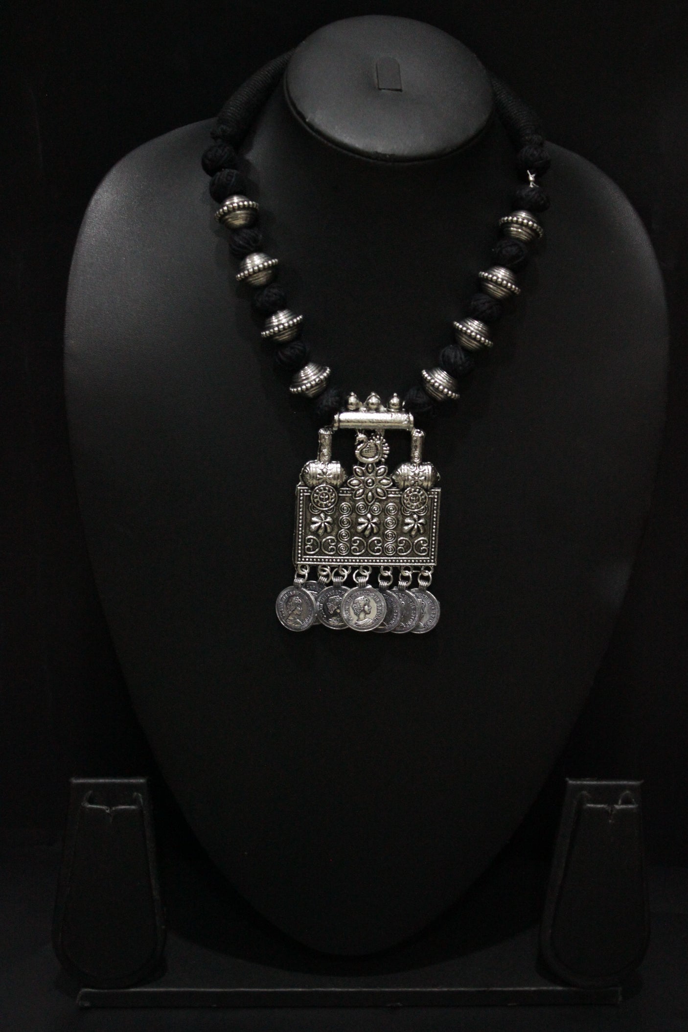 Intricately Detailed Statement Pendant Necklace with Stamped Coins and Thread Closure