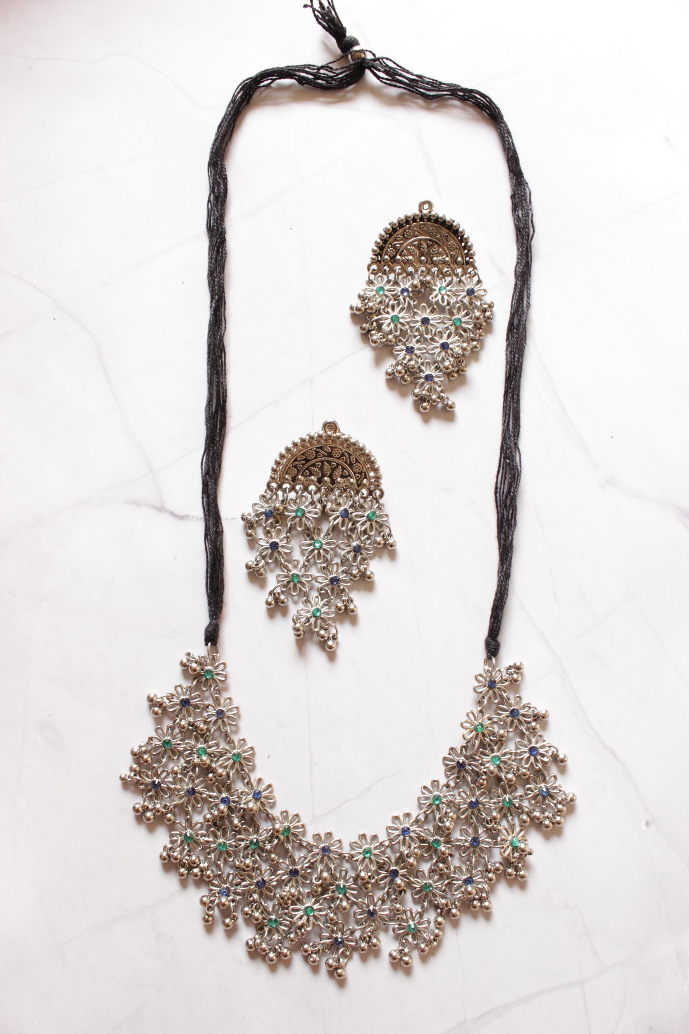 Silver FInish Green Stones Embedded Flower Motifs Adjustable Thread Closure Statement Necklace Set