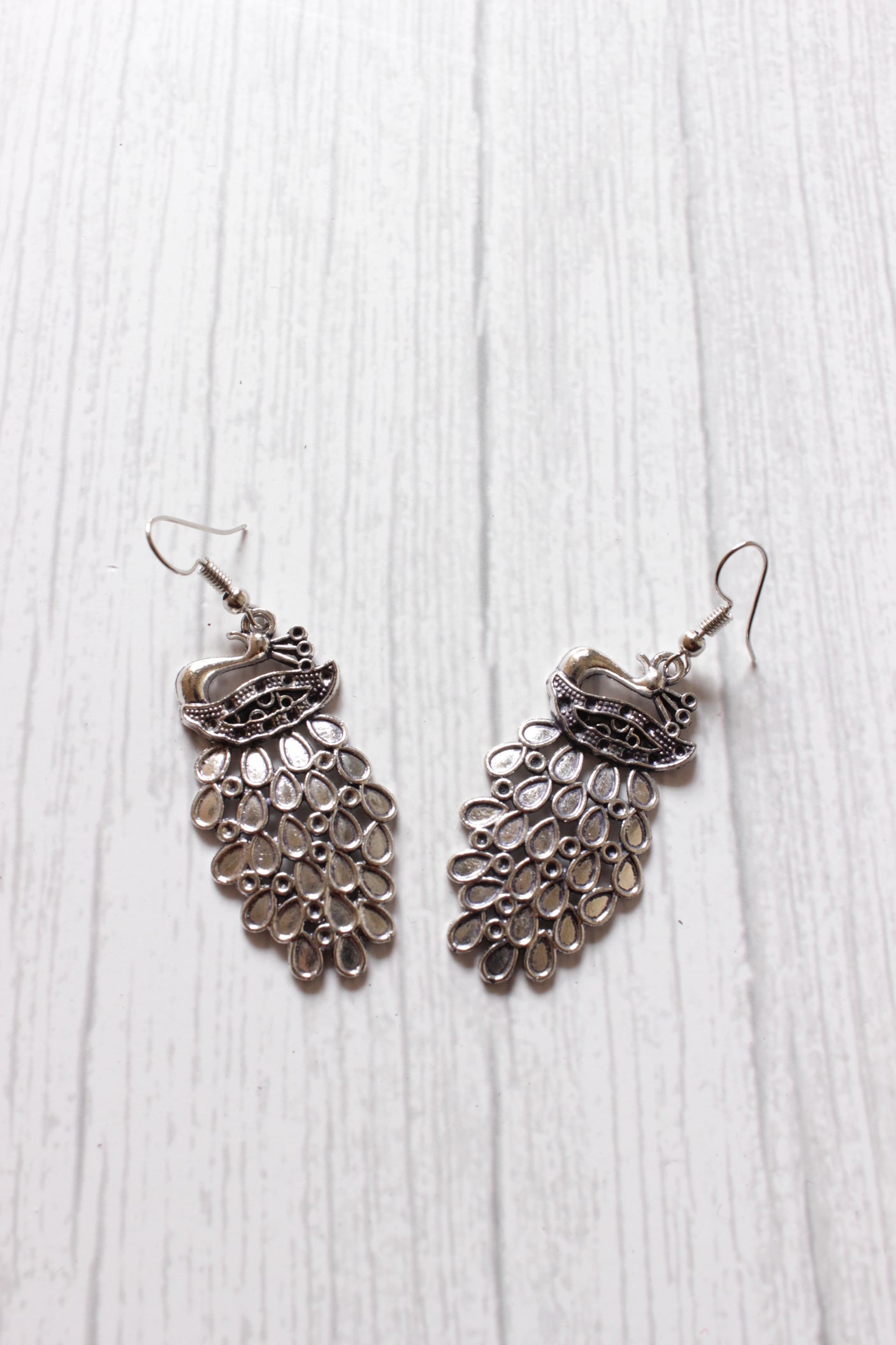 Bride in a Palki Intricately Detailed Silver Finish Necklace Set