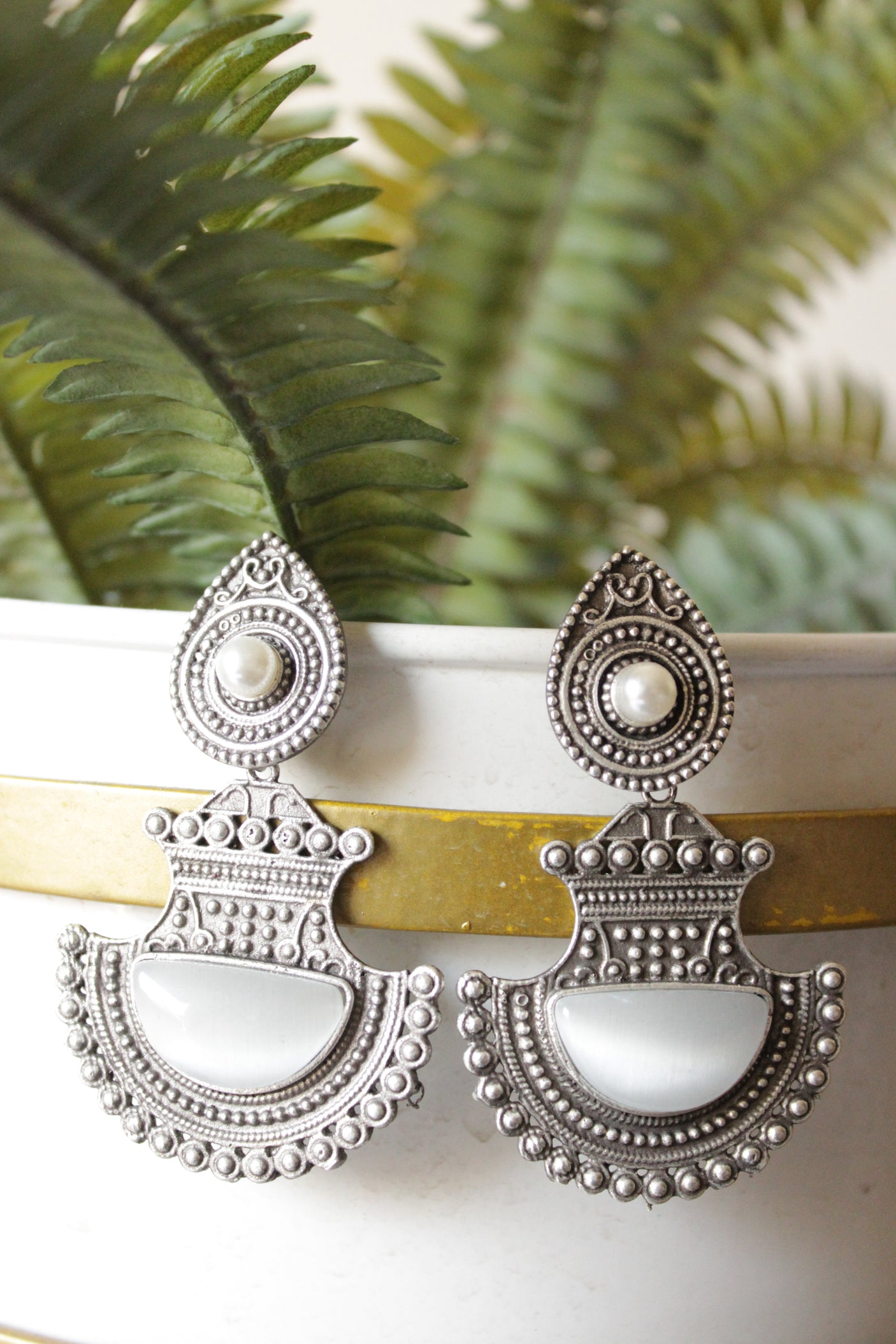 Ivory Glass Stone Embedded Premium Oxidised Finish Warrior Dangler Earrings