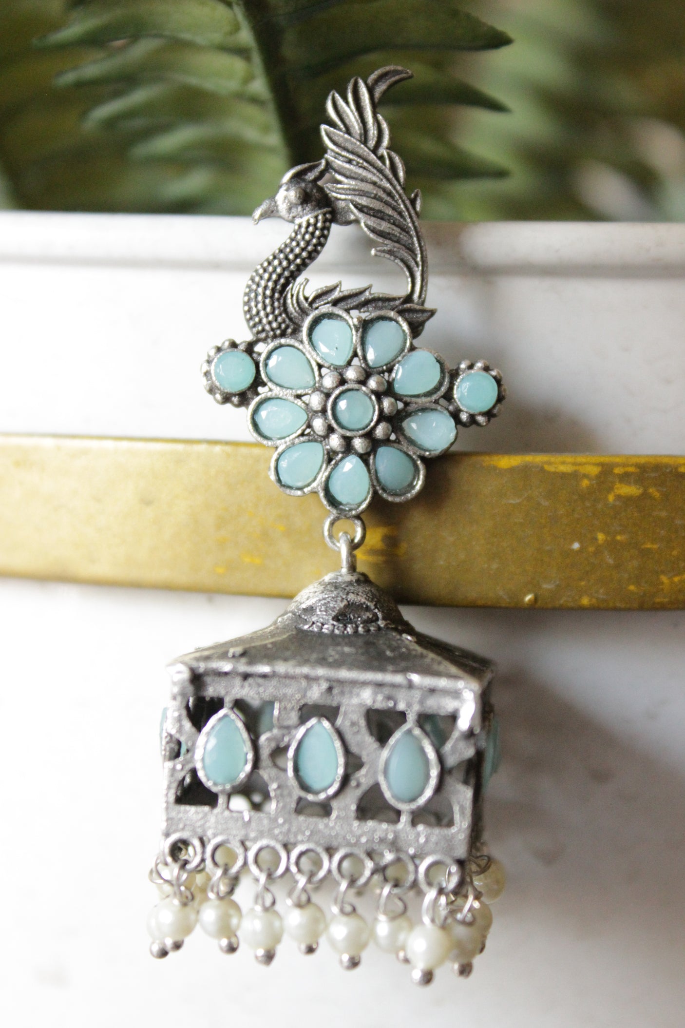 Turquoise Glass Stones Embedded Premium Oxidised Finish Peacock Motif Square Jhumka Earrings