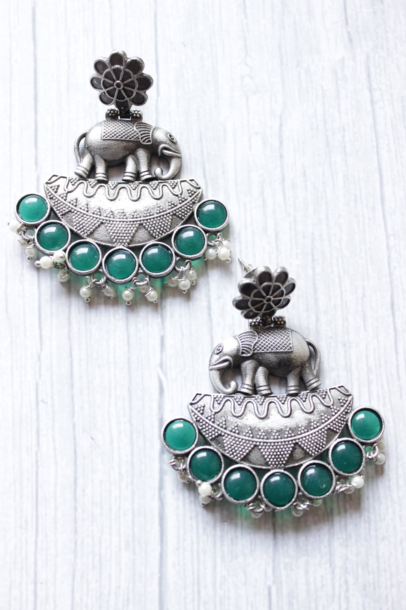 Green Glass Stones Embedded Premium Oxidised Finish Elephant Motif Dangler Earrings