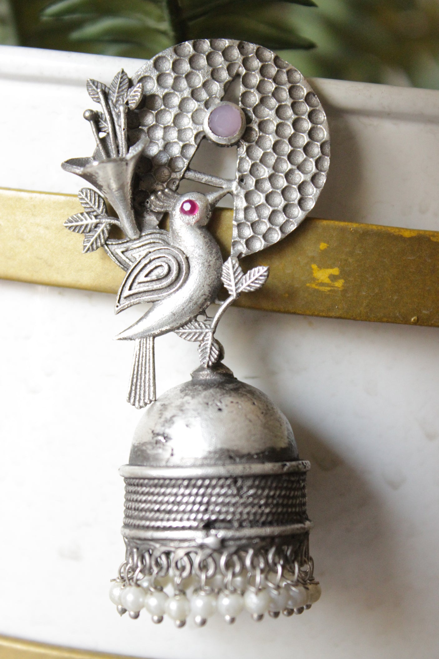 Pink & Red Stones Embedded Silver Finish Peacock Motif Statement Jhumka Earrings Accentuated with White Beads