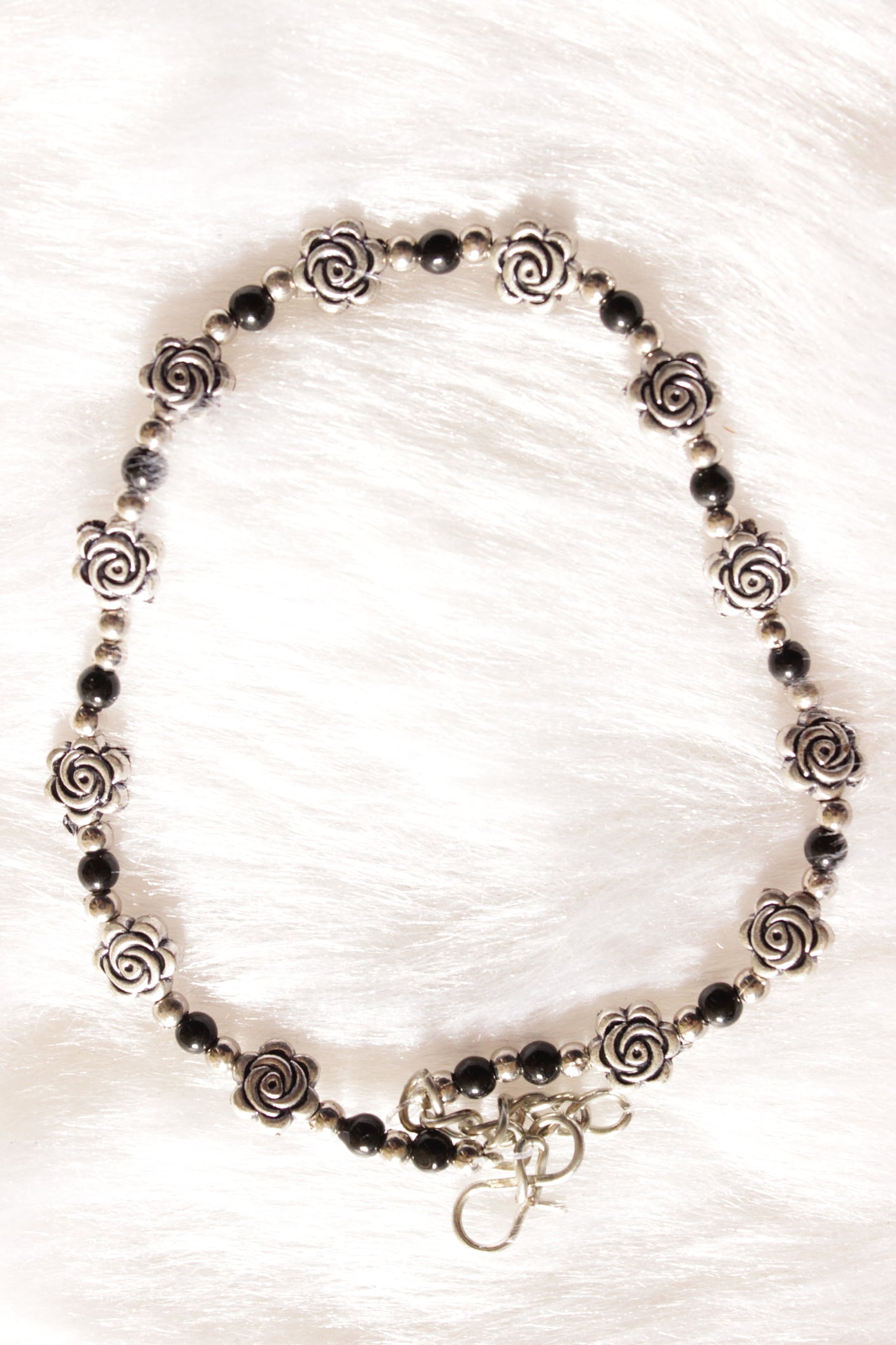 Silver Finish Flower Motif Charms Intertwined with Black Beads Set of 2 Anklets