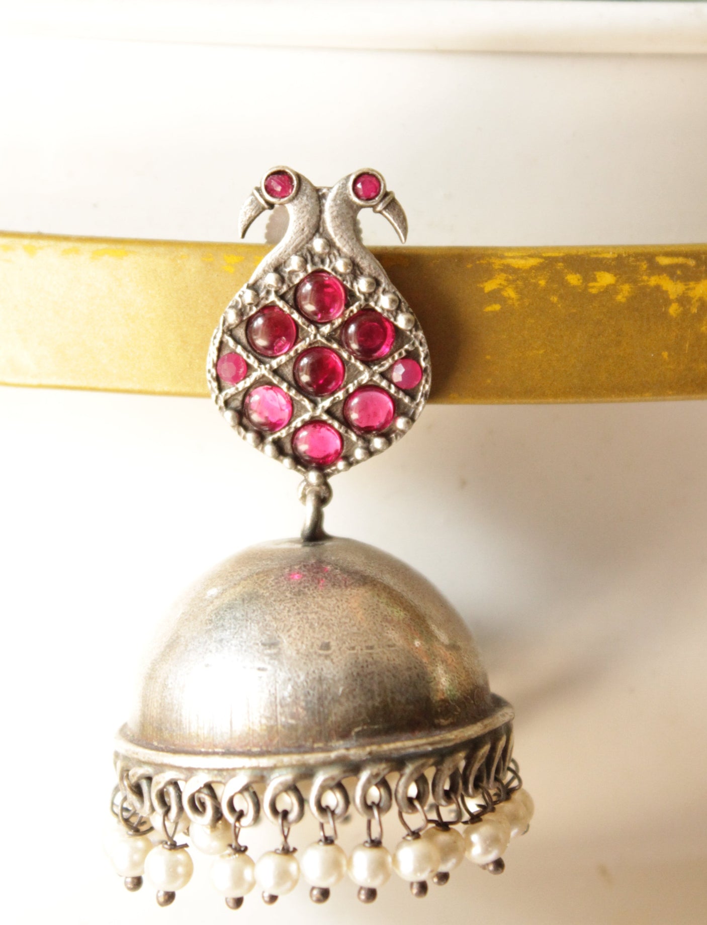 Fuchsia Glass Stones Embedded Peacock Motif Premium Oxidised Finish Brass Jhumka Earrings