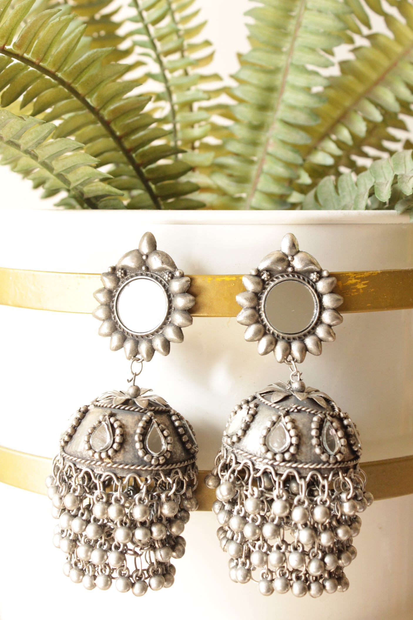 Mirror and Glass Stones Embedded Premium Oxidised Finish Brass Jhumka Earrings