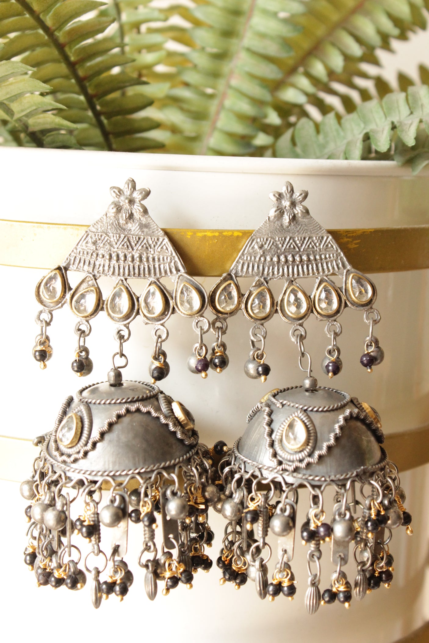 Dual Tone Kundan Stones Embedded Oxidised Finish Jhumka Earrings Finished with Black Beads