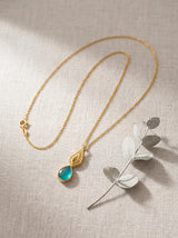 Nature Inspired Gold Pendant Necklace with Blue Crystal