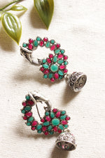 Load image into Gallery viewer, Oxidised Finish Green &amp; Red Glass Stones Embedded Peacock Shape Ethnic Jhumka Earrings
