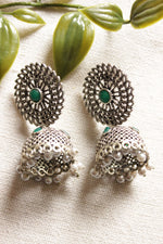 Load image into Gallery viewer, Jaali Pattern Green Center Stone Silver Finish Jhumka Earrings
