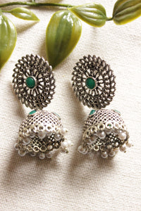 Jaali Pattern Green Center Stone Silver Finish Jhumka Earrings