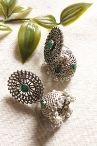 Jaali Pattern Green Center Stone Silver Finish Jhumka Earrings