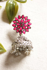 Load image into Gallery viewer, Flower Shape Silver Finish Pink Glass Stones Embedded Jhumka Earrings
