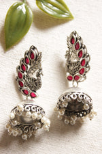 Load image into Gallery viewer, Peacock Shape Oxidised Finish Pink Glass Stones Embedded Jhumka Earrings
